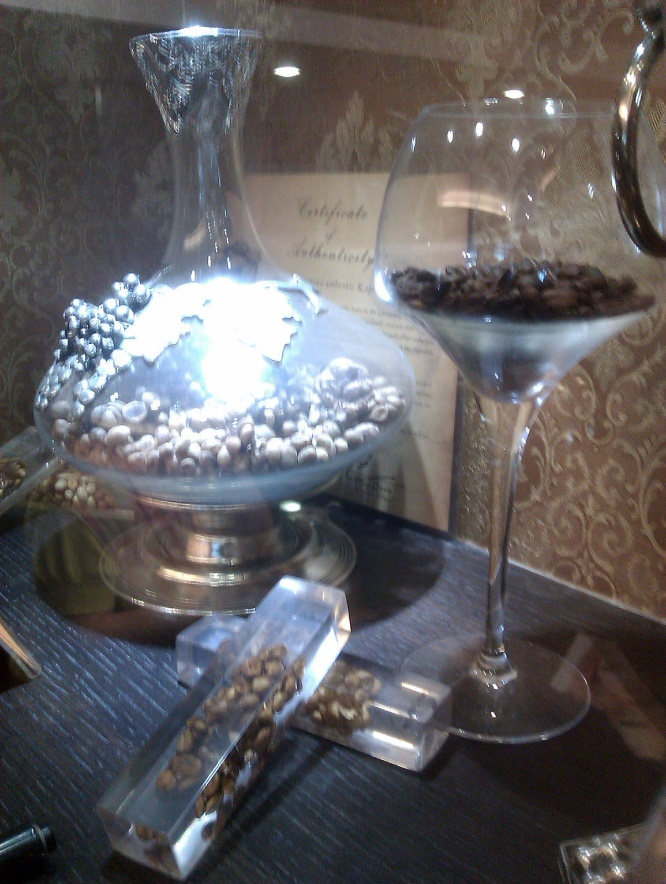 Pic 6: A window display in an upscale coffee shop showing Luwak Coffee in forms of defecated clumps (bottom), unroasted beans (left) and roasted beans (right)- By CaliPhattie - Martin Coffee Shop in Taipei City, Taiwan., FAL, https://commons.wikimedia.org/w/index.php?curid=15443328